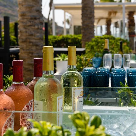 Minos Imperial Luxury Beach Resort & Spa Milatos Extérieur photo Wine at a poolside bar