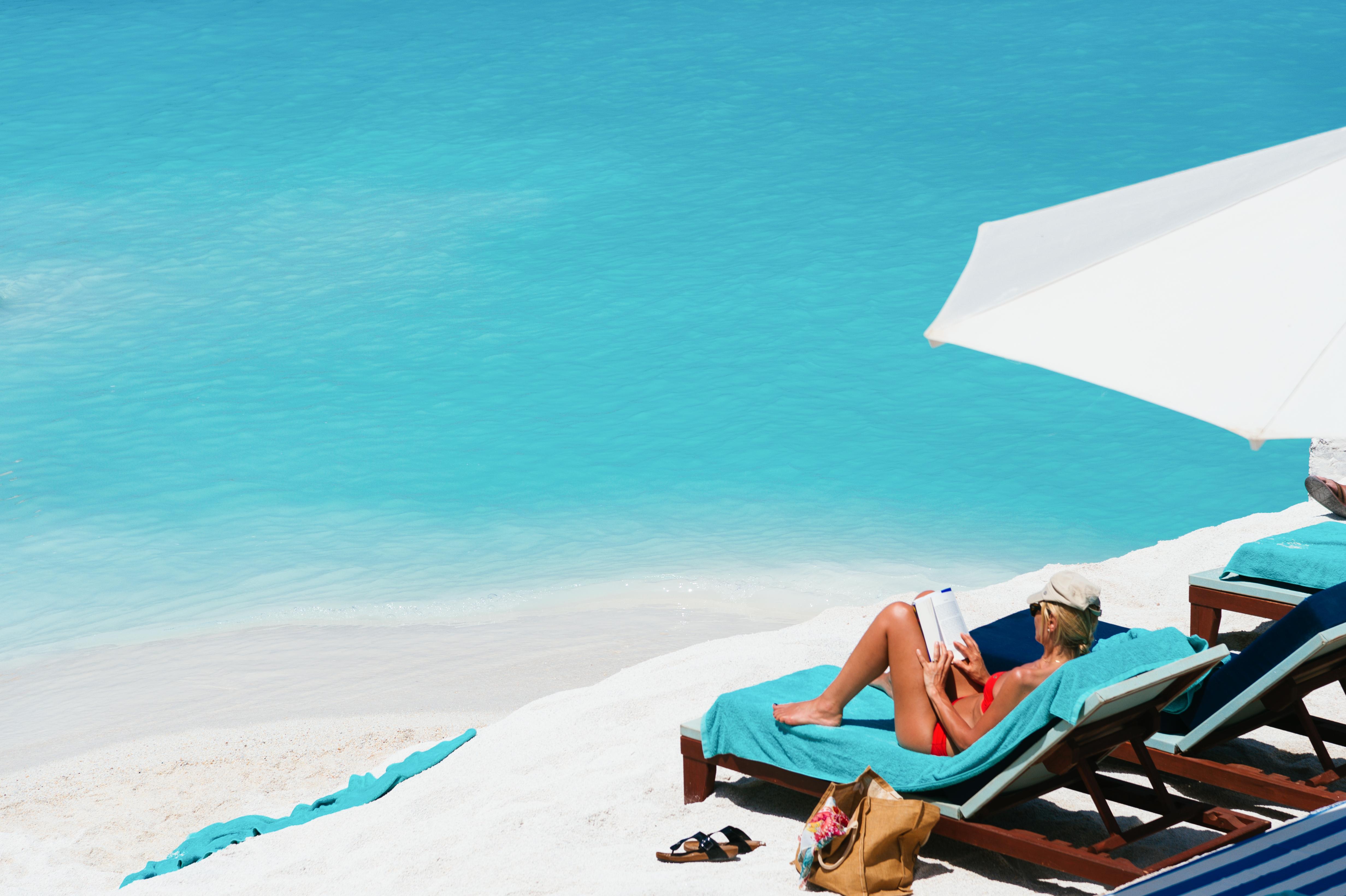 Minos Imperial Luxury Beach Resort & Spa Milatos Extérieur photo A woman sunbathing on a beach