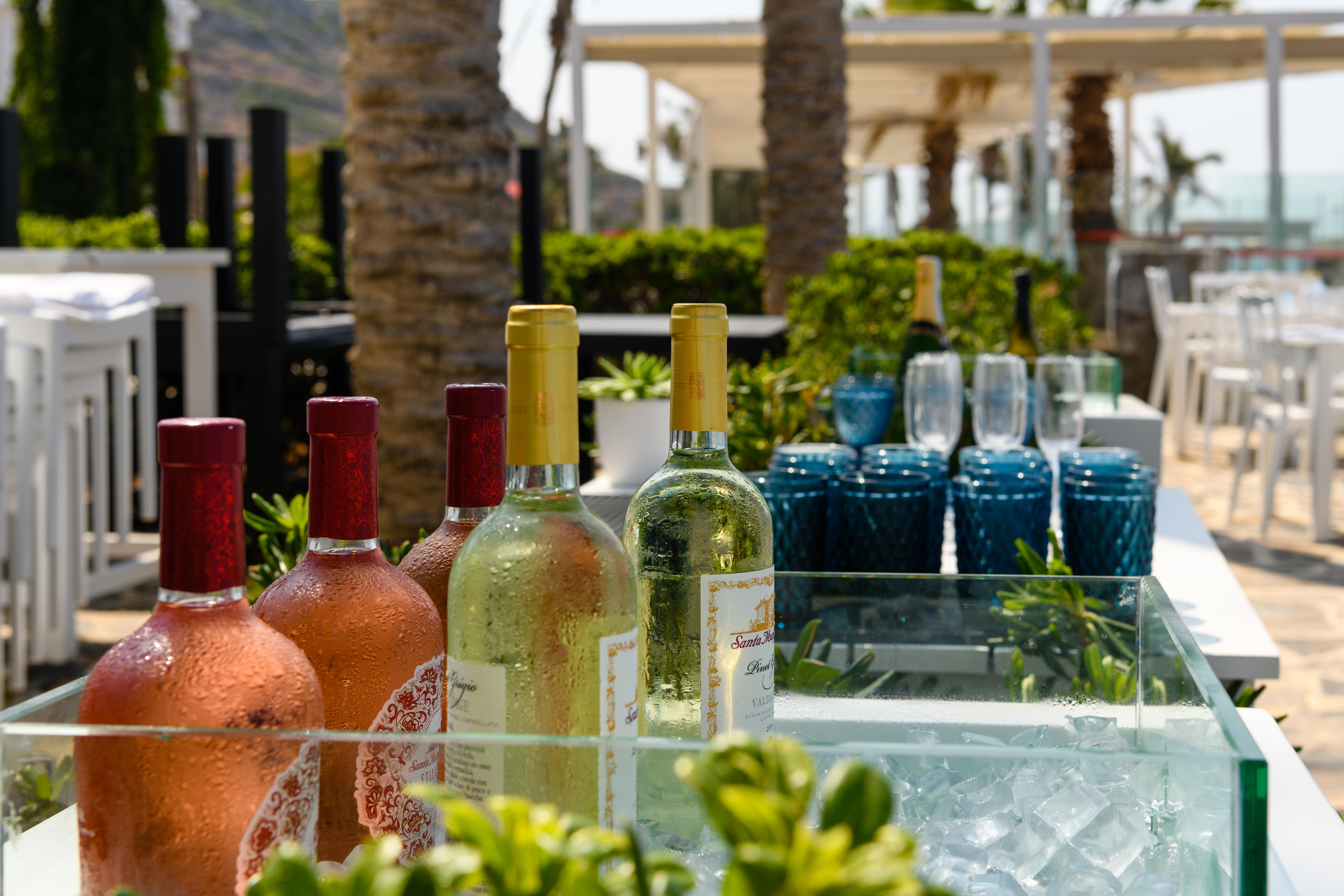 Minos Imperial Luxury Beach Resort & Spa Milatos Extérieur photo Wine at a poolside bar