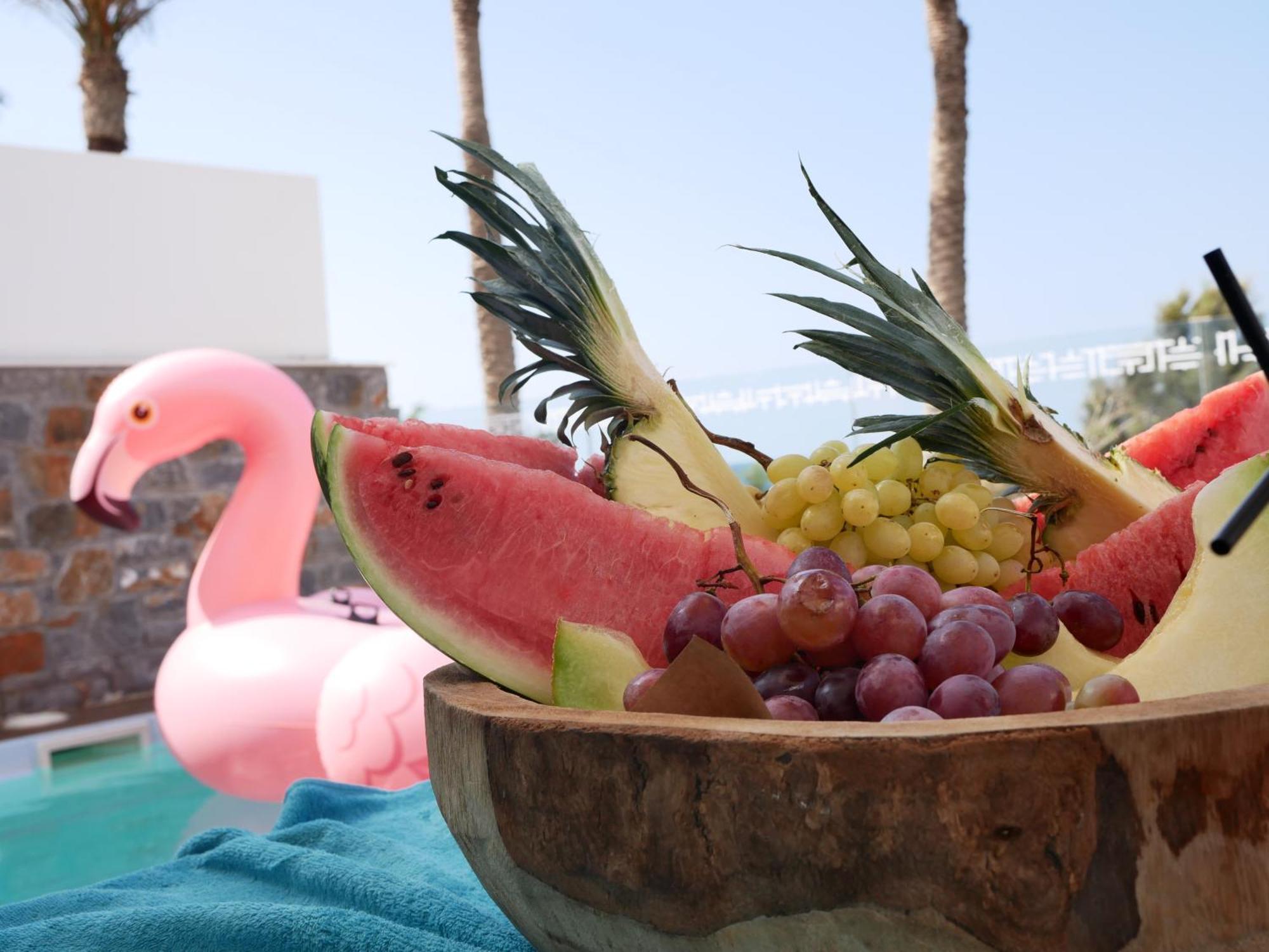 Minos Imperial Luxury Beach Resort & Spa Milatos Extérieur photo A pink flamingo float